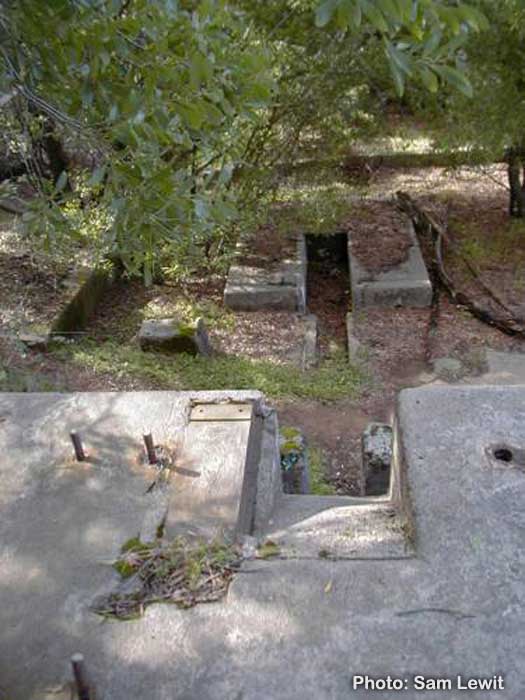 wheelwell
This is a view of what is being called the concrete bunker. According to the maps, this was the upper portion of a cable tram which traversed down to about the middle of where Hwy 13 is now. On the right side was a conveyor tram which went down to over Hw
