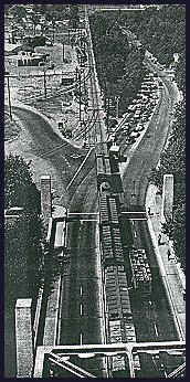 Sacramento_Capitol_Ave_Xing
This is an arial view of the mainline entering the Tower Bridge in Sacramento. Notice the track enters down the center of the bridge, blocking all traffic entering into Sacramento on West Capitol Ave. (formerly M St.).
